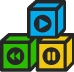 Image of green, blue and yellow building blocks with media file player icons (play, pause, rewind)