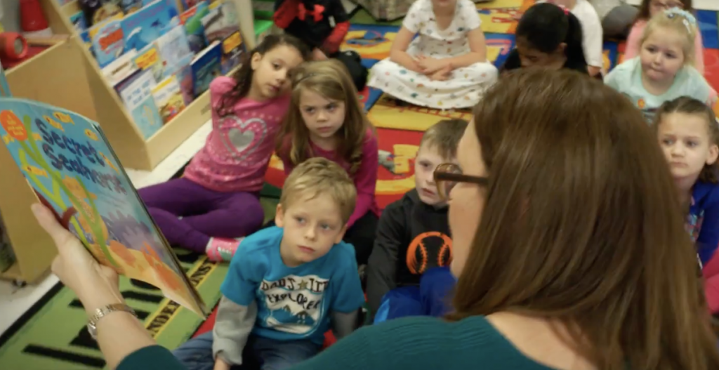 teacher reading to students